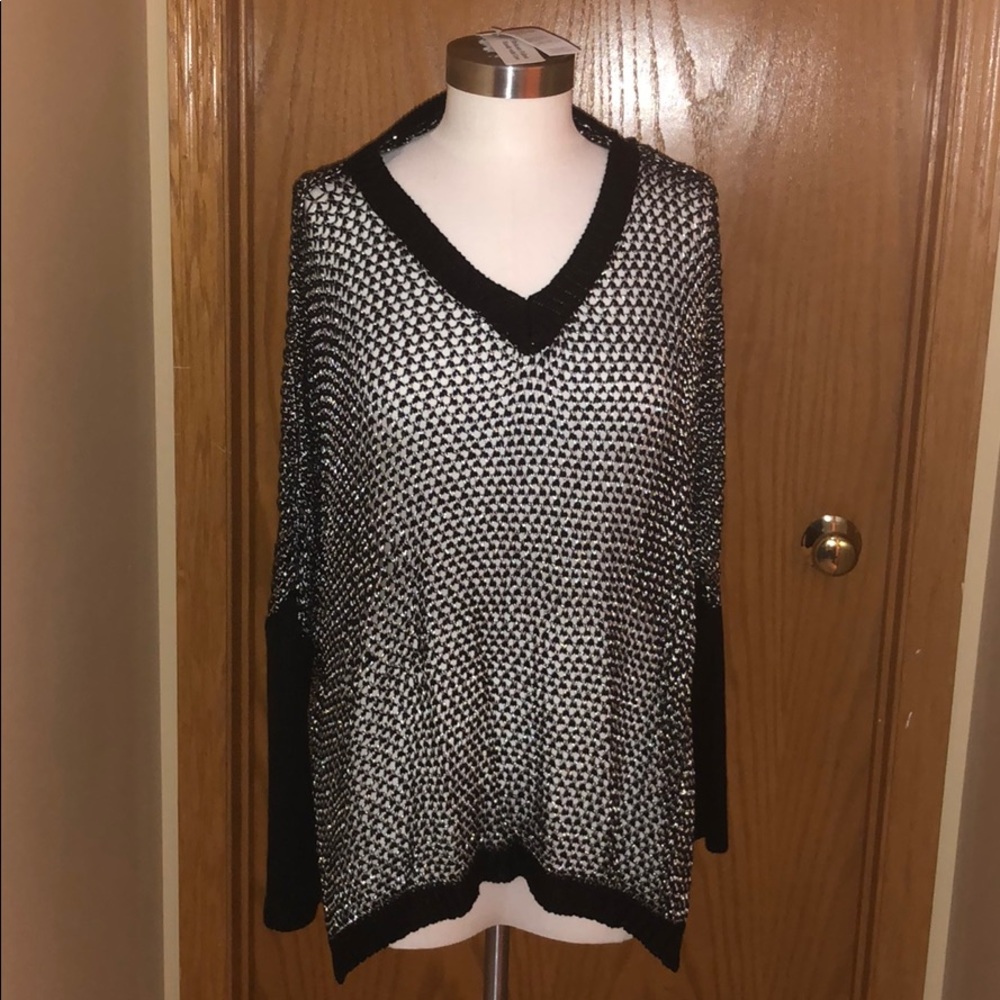 Silver and black sweater.